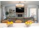 Open-concept living room with hardwood floors, fireplace, and chandelier; perfect for Gathering gatherings at 11830 Kingsbarns Ct, Las Vegas, NV 89141
