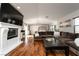 Spacious living room with fireplace, a comfortable sofa, and hardwood floors at 11830 Kingsbarns Ct, Las Vegas, NV 89141