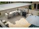 Elevated view of a luxurious outdoor kitchen with stainless steel appliances under a covered patio at 11830 Kingsbarns Ct, Las Vegas, NV 89141