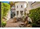 Private patio area with decorative stone landscaping and comfortable seating at 11830 Kingsbarns Ct, Las Vegas, NV 89141