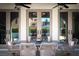 Inviting outdoor patio features stylish seating, ceiling fans, and elegant French doors at 11830 Kingsbarns Ct, Las Vegas, NV 89141