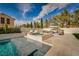 Inviting pool and spa area with lush landscaping and comfortable lounge seating at 11830 Kingsbarns Ct, Las Vegas, NV 89141