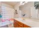 Bathroom featuring a flamingo shower curtain and wood vanity at 1291 Rolling Sunset St, Henderson, NV 89052