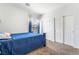 This bedroom features carpeted floors, and a large closet with sliding doors at 1291 Rolling Sunset St, Henderson, NV 89052