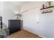 This bedroom has carpeted floors, a closet and a small table at 1291 Rolling Sunset St, Henderson, NV 89052