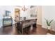 Dining room featuring hardwood floors, modern chandelier and lots of natural light at 1291 Rolling Sunset St, Henderson, NV 89052