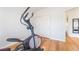 Exercise room with an elliptical machine and hard wood floors at 1291 Rolling Sunset St, Henderson, NV 89052