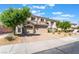 A two-story home featuring a three-car garage and well-maintained landscaping at 1291 Rolling Sunset St, Henderson, NV 89052