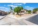 A two-story home with a three-car garage and desert landscaping at 1291 Rolling Sunset St, Henderson, NV 89052