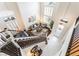 Bright foyer with hardwood stairs, high ceilings, and a view to the living room at 1291 Rolling Sunset St, Henderson, NV 89052