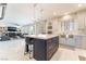 Bright kitchen features an island with seating, stainless steel appliances, and an open layout at 1291 Rolling Sunset St, Henderson, NV 89052
