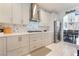 Stylish kitchen with white cabinets, stainless steel appliances, and white countertops at 1291 Rolling Sunset St, Henderson, NV 89052