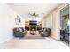 Cozy living room features a fireplace, built-in shelving, ceiling fan, and access to the backyard at 1291 Rolling Sunset St, Henderson, NV 89052