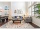 Bright living room with high ceilings and large windows at 1291 Rolling Sunset St, Henderson, NV 89052