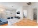 The living room features wood flooring, a TV, and modern furniture at 1291 Rolling Sunset St, Henderson, NV 89052