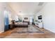 Bright main bedroom featuring hardwood floors, ensuite access, and comfortable furnishings at 1291 Rolling Sunset St, Henderson, NV 89052