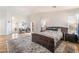 Spacious main bedroom with hardwood floors, bright windows and an ensuite bathroom at 1291 Rolling Sunset St, Henderson, NV 89052
