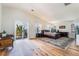Large main bedroom with balcony access, and hardwood floors at 1291 Rolling Sunset St, Henderson, NV 89052