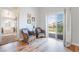 Relaxing sitting area off the main bedroom featuring outdoor access and views to the community at 1291 Rolling Sunset St, Henderson, NV 89052