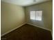 Bedroom with neutral walls, carpeted flooring, and a window for natural light at 137 Coronation Ave, Las Vegas, NV 89123