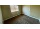 Standard bedroom with neutral paint, plush carpet, and a closet with sliding doors at 137 Coronation Ave, Las Vegas, NV 89123