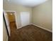 Bedroom with neutral walls, carpeted flooring, and a closet with sliding doors at 137 Coronation Ave, Las Vegas, NV 89123