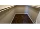 Large walk-in closet with high shelving and plush carpeting for extra storage at 137 Coronation Ave, Las Vegas, NV 89123