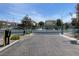 Community entrance with automatic gate and lush desert landscaping at 137 Coronation Ave, Las Vegas, NV 89123