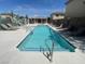 Well-maintained community pool area with lounge chairs and desert landscaping at 137 Coronation Ave, Las Vegas, NV 89123
