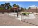 Spacious dog park featuring a shaded bench area, walking paths, and a pet-friendly environment at 137 Coronation Ave, Las Vegas, NV 89123