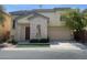 Inviting two-story home with stone accents, manicured landscaping, and a spacious two-car garage at 137 Coronation Ave, Las Vegas, NV 89123