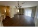 Open-concept living room with tile floors, modern lighting, and sliding glass doors to the backyard at 137 Coronation Ave, Las Vegas, NV 89123