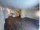 Open-concept living room and kitchen with tile floors and modern lighting at 137 Coronation Ave, Las Vegas, NV 89123