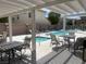 Relaxing poolside patio area with shaded seating, perfect for enjoying sunny days by the pool at 137 Coronation Ave, Las Vegas, NV 89123