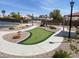 Beautifully landscaped putting green with well-manicured grass, seating, and desert surroundings at 137 Coronation Ave, Las Vegas, NV 89123