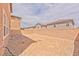 Large backyard featuring a brick wall, offering privacy and space for activities at 156 Fulgora St, Henderson, NV 89074