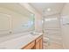 Inviting bathroom featuring a single vanity, spacious counter, and a shower-tub combo at 156 Fulgora St, Henderson, NV 89074
