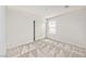 Comfortable bedroom featuring neutral carpet, bright window, and a closet with sliding doors at 156 Fulgora St, Henderson, NV 89074