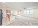 Open-concept living area with updated flooring, abundant natural light, and island at 156 Fulgora St, Henderson, NV 89074