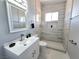 Modern bathroom showcasing a new vanity and a tiled walk-in shower with a small window at 1836 Mcdaniel St, North Las Vegas, NV 89030