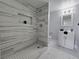 Modern bathroom with decorative tile shower and sleek vanity at 1836 Mcdaniel St, North Las Vegas, NV 89030