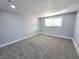 Bedroom featuring neutral-colored walls, plush carpeting, and ample natural light at 1836 Mcdaniel St, North Las Vegas, NV 89030
