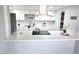 Bright kitchen featuring white cabinets, modern appliances, and a stylish countertop island, perfect for meal preparation at 1836 Mcdaniel St, North Las Vegas, NV 89030