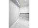 Functional laundry area featuring updated cabinets and sleek marble tile flooring at 1836 Mcdaniel St, North Las Vegas, NV 89030