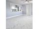 Bright living space showcasing stylish marble tile floors and an open view of the modern kitchen at 1836 Mcdaniel St, North Las Vegas, NV 89030