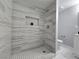 Modern shower with decorative tile and sleek fixtures at 1836 Mcdaniel St, North Las Vegas, NV 89030