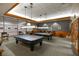 Well-appointed billiards room featuring pool tables, comfortable seating, and elegant decor at 2103 Poppywood Ave, Henderson, NV 89012