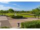 Picturesque park area with a decorative fountain, green spaces, and walking paths at 2103 Poppywood Ave, Henderson, NV 89012