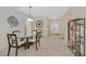 Bright dining area with a glass table and decorative wall art near the entry at 2103 Poppywood Ave, Henderson, NV 89012