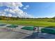 Golf driving range with multiple hitting bays, offering a picturesque view of the course at 2103 Poppywood Ave, Henderson, NV 89012